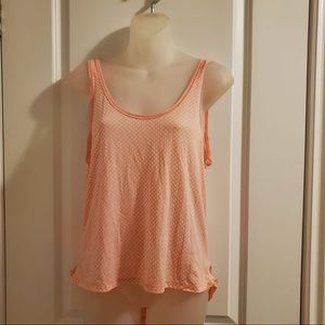 Lululemon peach coloured tank, longer in the back